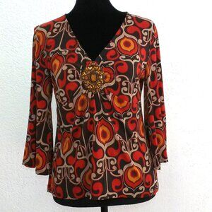 Orange/yellow/brown floral blouse, with amber rhinestone design